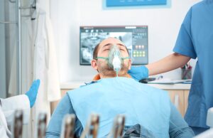 Patient with oxygen mask Patient with oxygen mask receiving anesthesic in dentistry cabinet